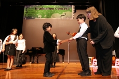 Twinkle students presenting graduation certificates